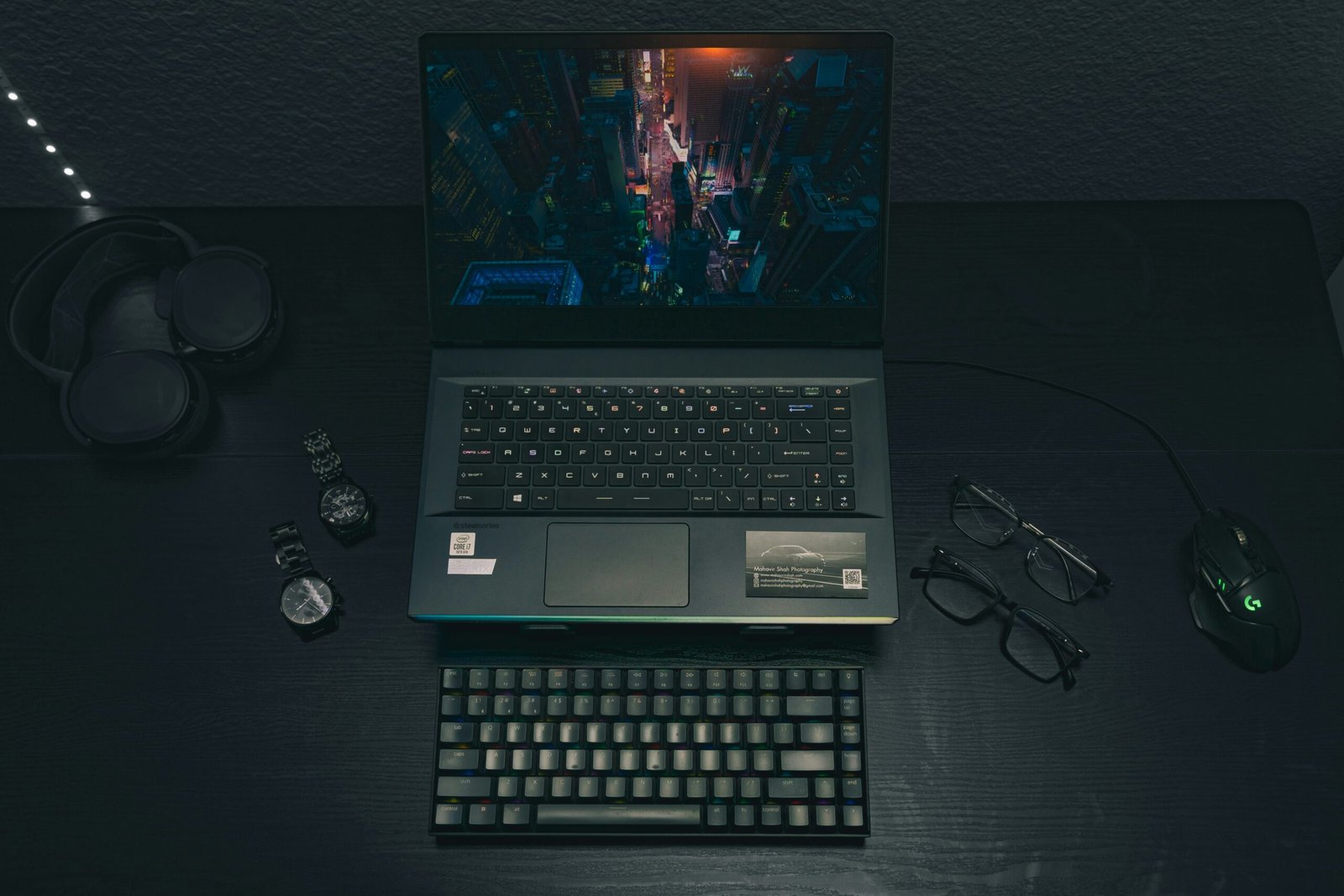 a laptop computer sitting on top of a wooden desk